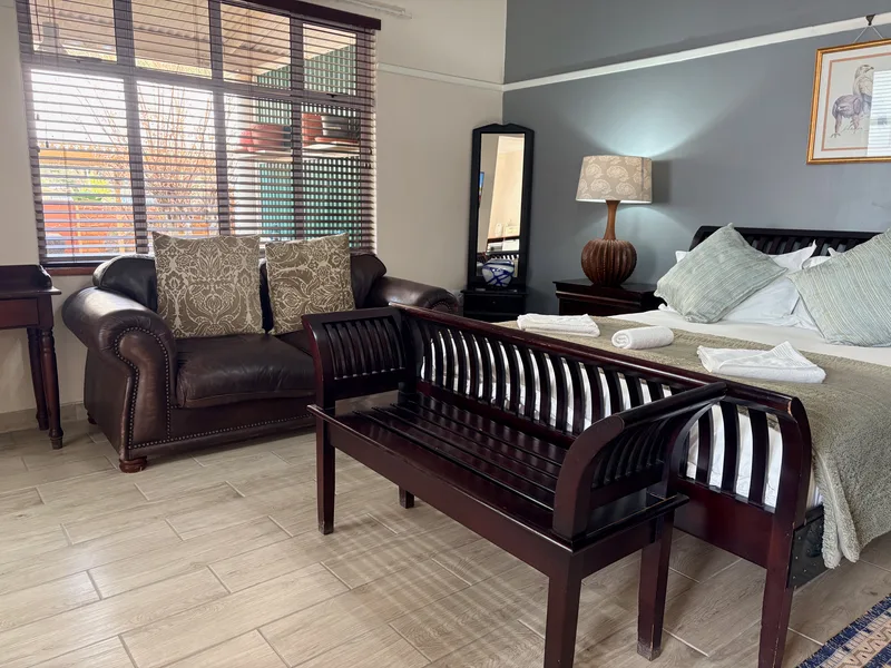 Room 5 queen-size bed and sofa